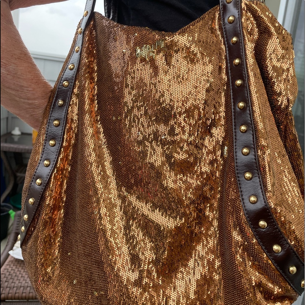 A gold/silver mermaid shoulder bag